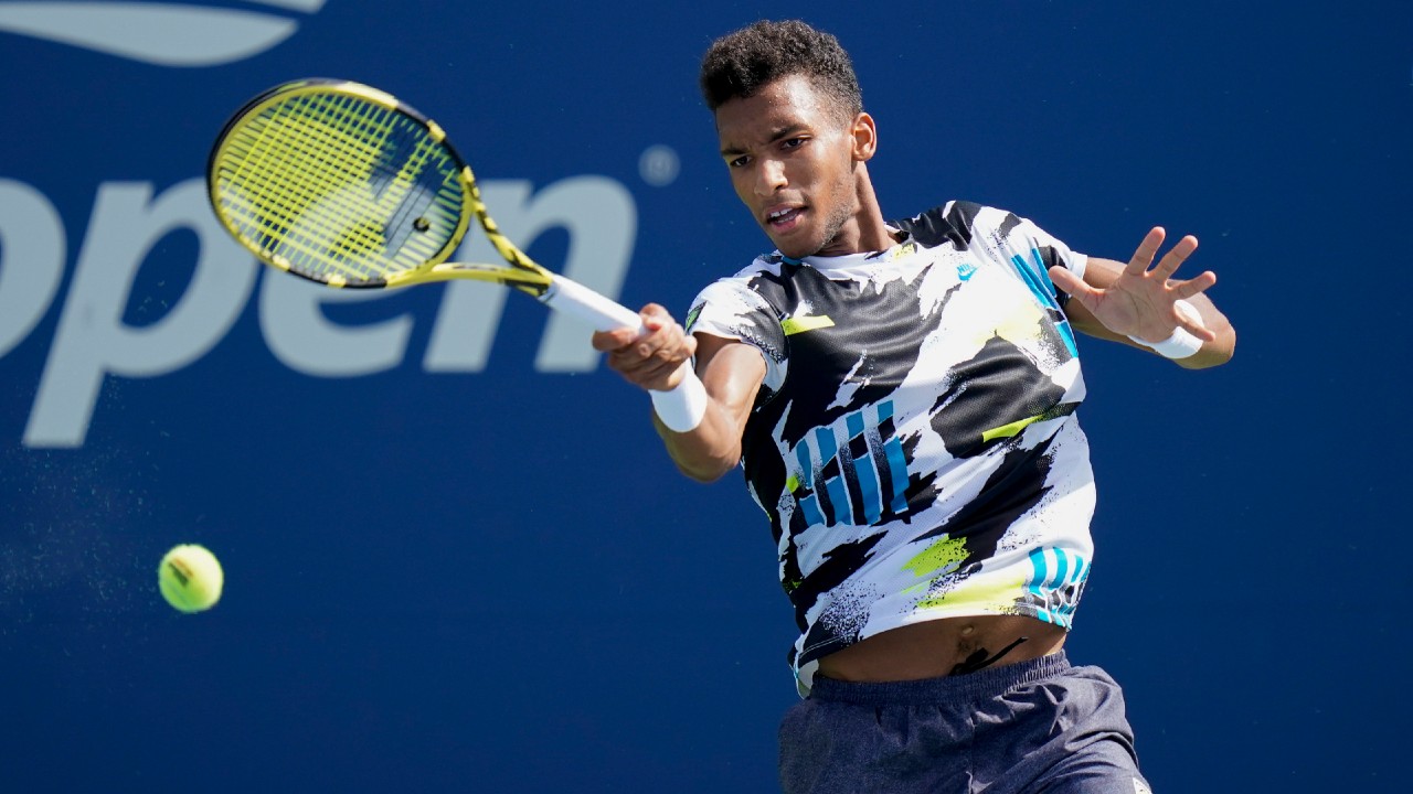Felix Auger-Aliassime returns a shot to Thiago Monteiro during the first round of the US Open. (Seth Wenig/AP)
