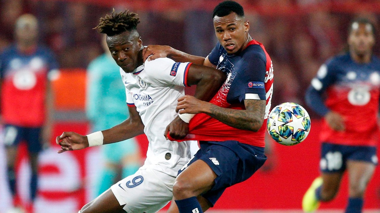 Chelsea's Tammy Abraham, left, fights for the ball with Lille's Gabriel during the group H Champions League soccer match between Lille and Chelsea at the Stade Pierre Mauroy - Villeneuve d'Ascq stadium in Lille, France, Wednesday, Oct. 2, 2019. (Michel Spingler / AP)