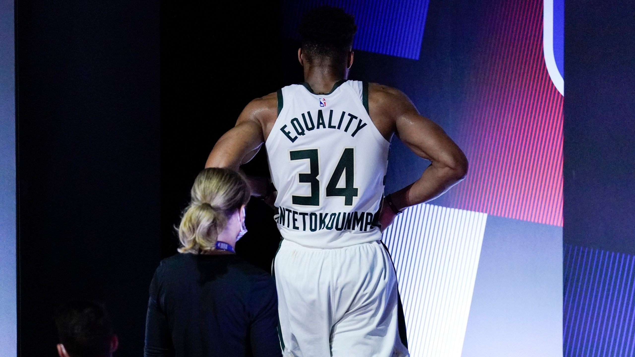 Milwaukee Bucks' Giannis Antetokounmpo leaves the court after hurting his ankle during the first half of an NBA conference semifinal playoff basketball game against the Miami Heat. (Mark J. Terrill/AP) 