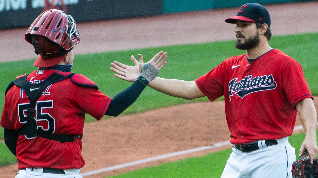Cleveland Indians' Roberto Perez (55) greets Indians closer Brad Hand after the final out of a baseball game against the Pittsburgh Pirates. (Phil Long/AP)