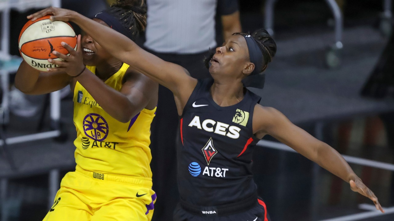 Las Vegas Aces' Sugar Rodgers, right, blocks a shot attempt by Los Angeles Sparks' Chelsea Gray during the first half of a WNBA basketball game Saturday, Sept. 12, 2020, in Bradenton, Fla. (Mike Carlson/AP)
