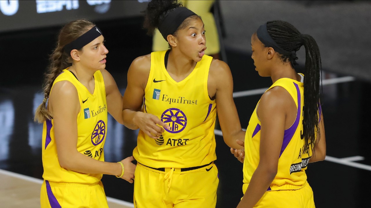 Los Angeles Sparks' Candace Parker, center, talks with Sydney Wiese (24) and Kristine Anigwe, right, during the first half of a WNBA basketball game against the Washington Mystics, Thursday, Aug. 13, 2020, in Bradenton, Fla. (Mike Carlson/AP)