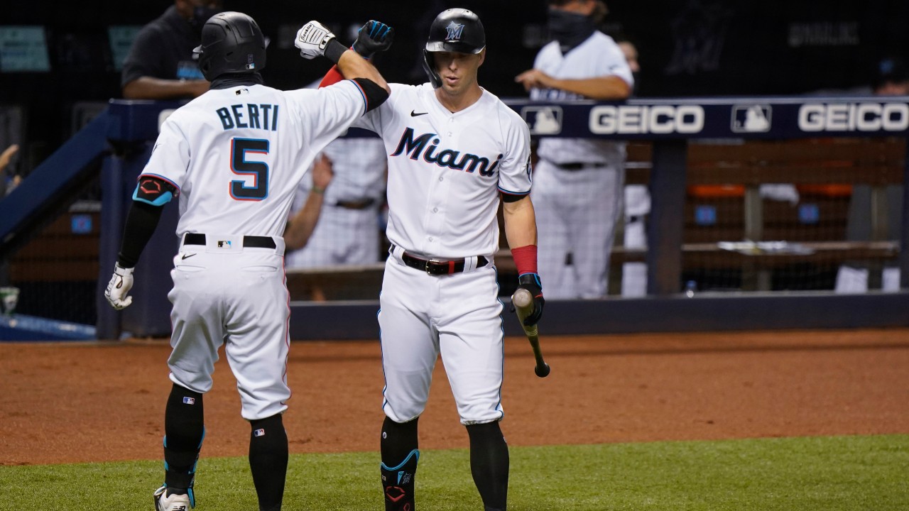 Miami Marlins' Jon Berti, left, is congratulated by Corey Dickerson, right, after Berti hit a home run during the third inning of a baseball game against the Toronto Blue Jays. (Wilfredo Lee/AP)