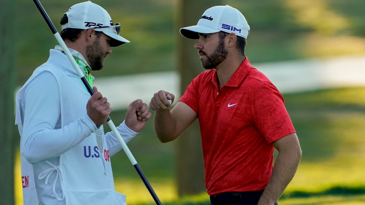 Matthew Wolff, right, bumps fists with his caddie after finishing the third round of the US Open Golf Championship, Saturday, Sept. 19, 2020, in Mamaroneck, N.Y. (Charles Krupa/AP)