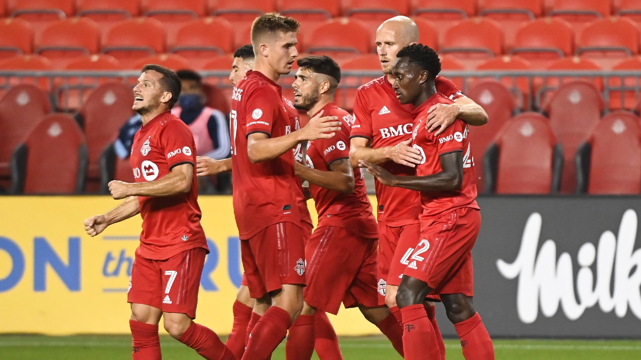 Toronto FC midfielder Richie Laryea (22) celebrates a goal with teammates. (Nathan Denette/CP)