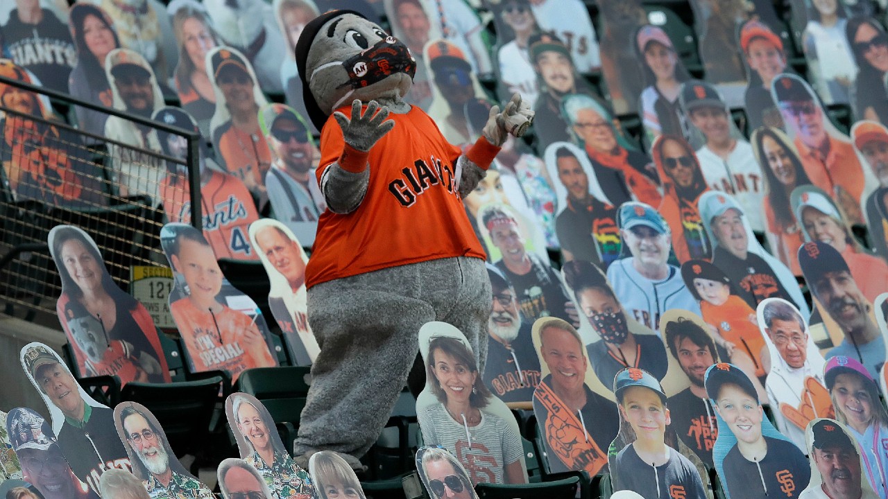 San Francisco Giants mascot Lou Seal gestures among cardboard cutout fans. (Ben Margot/AP)