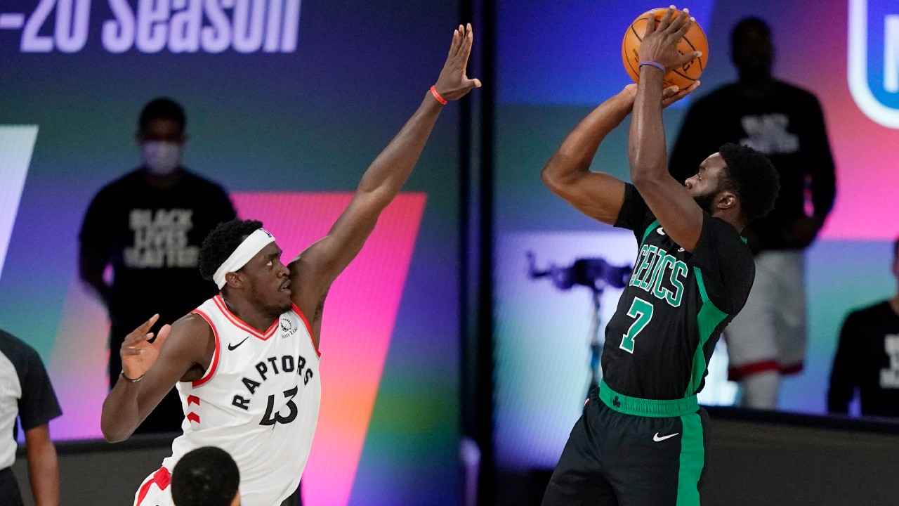 Boston Celtics' Jaylen Brown (7) shoots as Toronto Raptors' Pascal Siakam (43) defends in the first half of an NBA conference semifinal playoff basketball game. (Mark J. Terrill/AP) 