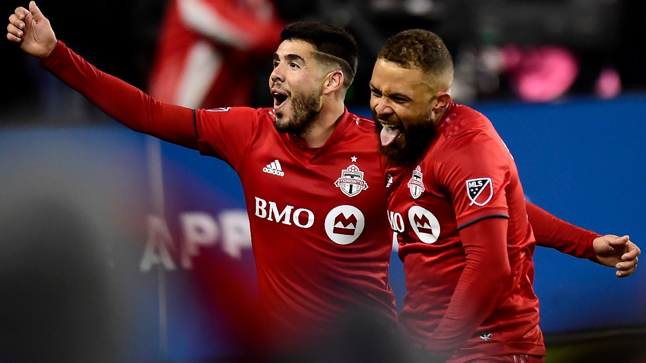 Toronto FC midfielder Nick DeLeon (18) celebrates his goal with teammate Alejandro Pozuelo (10) during extra time MLS playoff soccer action against the D.C. United, in Toronto on Saturday, Oct. 19, 2019. (Frank Gunn/CP)