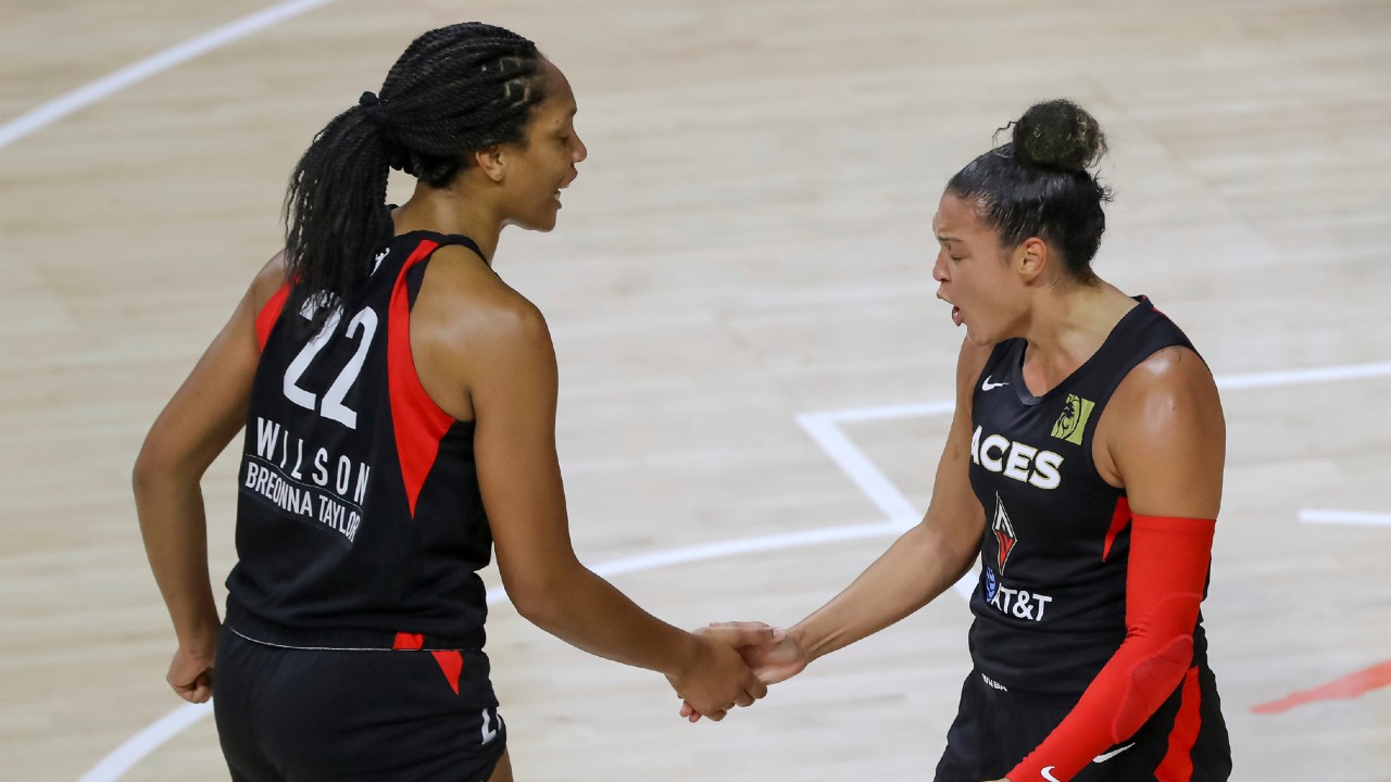 Las Vegas Aces' Kayla McBride, right, celebrates with A'ja Wilson after a basket against the Connecticut Sun during the first half of a WNBA basketball game Thursday, Aug. 20, 2020, in Bradenton, Fla. (Mike Carlson/AP)