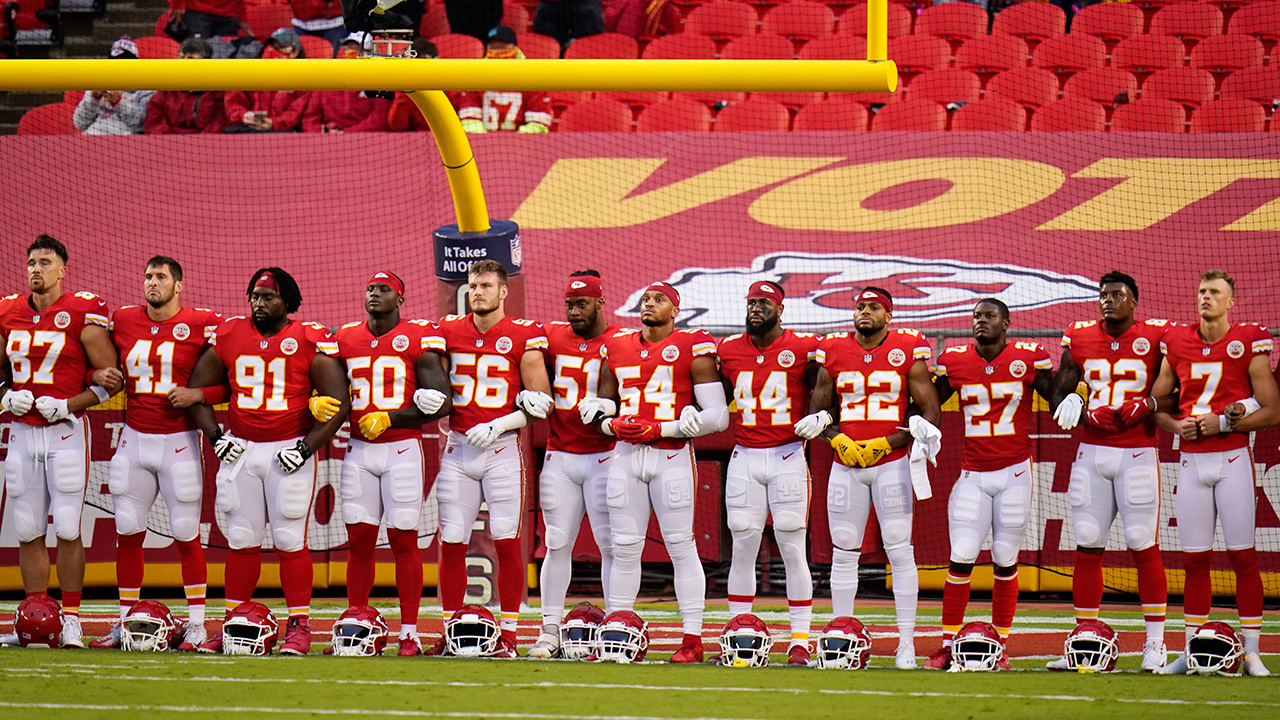 Kansas City Chiefs players stand for a presentation on social justice before the NFL opener against the Houston Texans Thursday, Sept. 10, 2020, in Kansas City, Mo. (Charlie Riedel/AP)