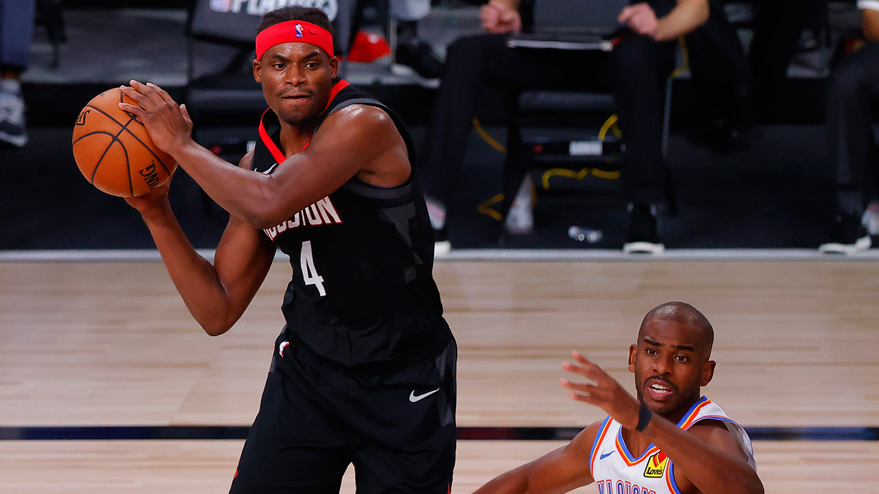 Houston Rockets' Danuel House Jr. (4) passes against Oklahoma City Thunder's Chris Paul (3) during the first quarter of Game 4 of a first-round playoff series, Monday, Aug. 24, 2020, in Lake Buena Vista, Fla. (Kevin C. Cox/Pool Photo via AP)