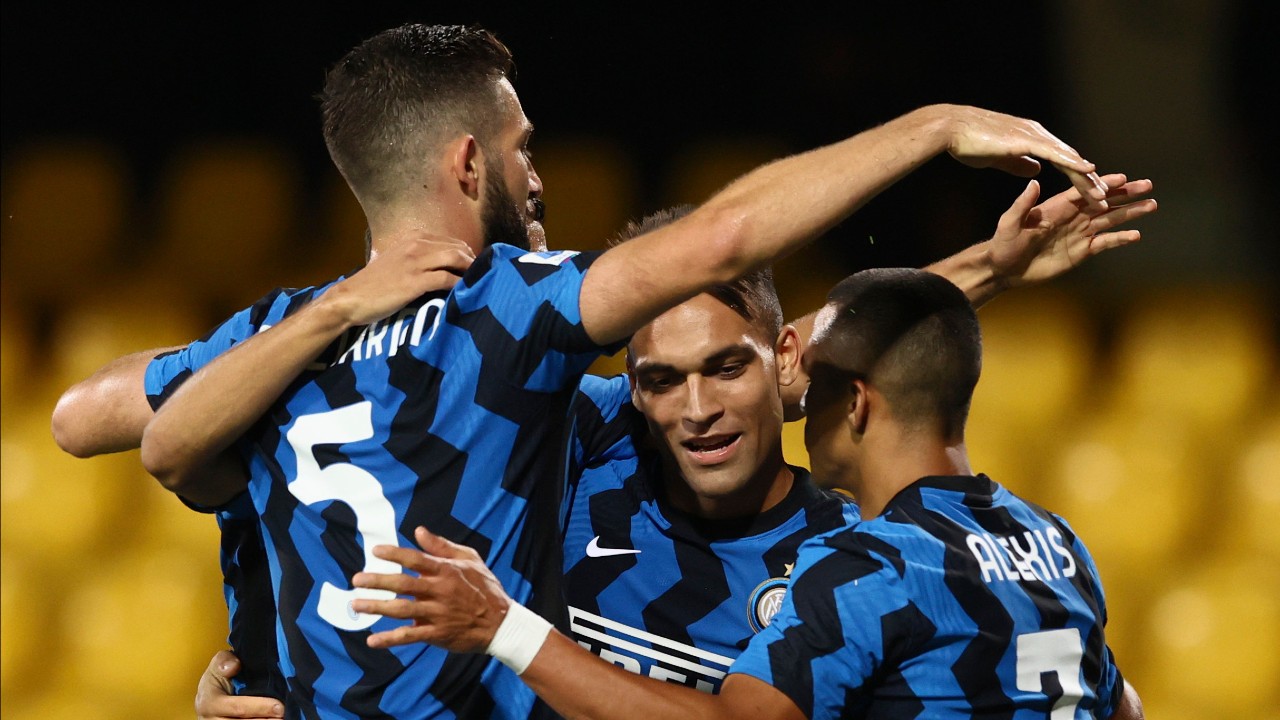 Inter's Lautaro Martinez, center, celebrates with teammates after scoring during the Serie A soccer match between Benevento and Inter Milan at the Ciro Vigorito stadium in Benevento, Italy, Wednesday, Sept. 30, 2020. (Alessandro Garofalo/LaPresse via AP)