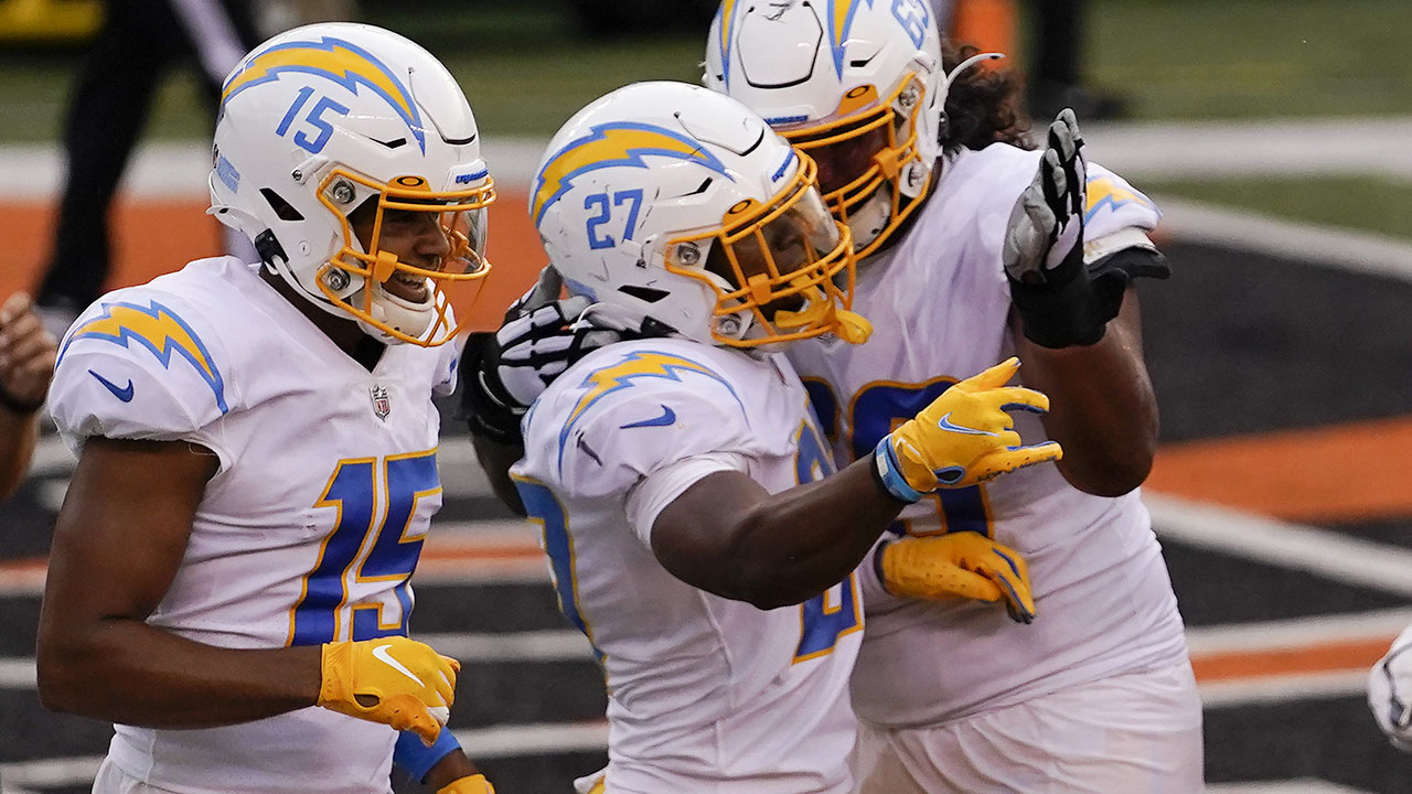 Los Angeles Chargers running back Joshua Kelley celebrates with teammates after scoring a rushing touchdown on Sunday, Sept. 13. (AP Photo/Bryan Woolston)