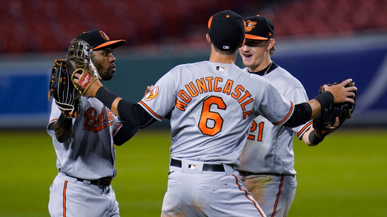 Baltimore Orioles' Cedric Mullins, left, celebrates with Ryan Mountcastle (6) and Austin Hays after the team's 13-1 win over the Boston Red Sox in a baseball game at Fenway Park in Boston, Thursday, Sept. 24, 2020. (Charles Krupa/AP)