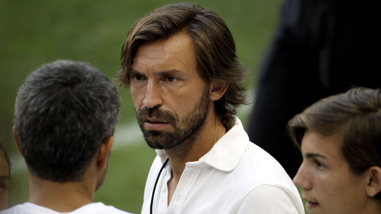 Andrea Pirlo, center, watches Juventus during a training session. (Julio Cortez/AP)