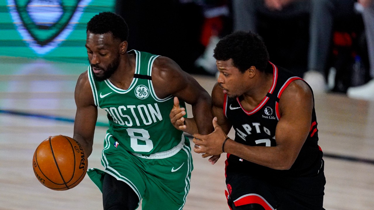 Toronto Raptors guard Kyle Lowry (7) tries to hold on to Boston Celtics guard Kemba Walker (8) during the second half of an NBA conference semifinal playoff basketball game Wednesday, Sept. 9, 2020, in Lake Buena Vista, Fla. (Mark J. Terrill/AP)