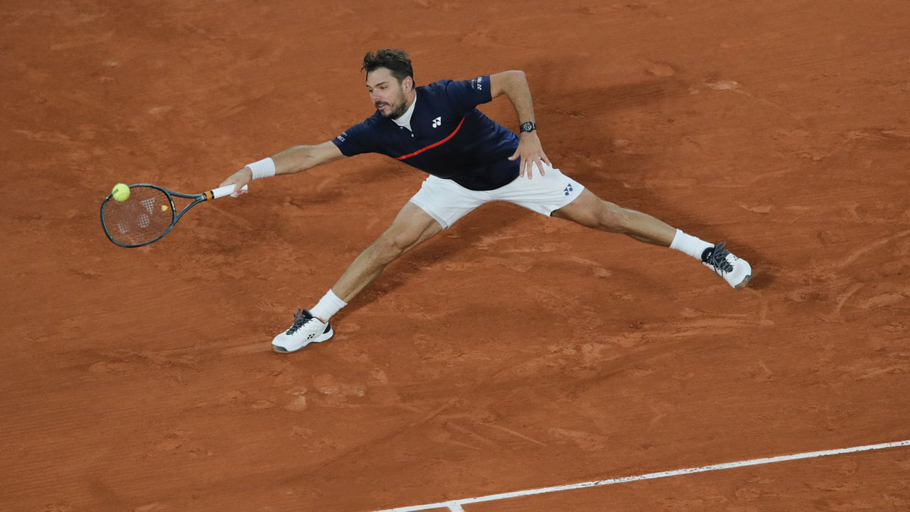 Switzerland's Stan Wawrinka plays a shot against Britain's Andy Murray in the first round match of the French Open tennis tournament at the Roland Garros stadium in Paris. (Christophe Ena/AP)