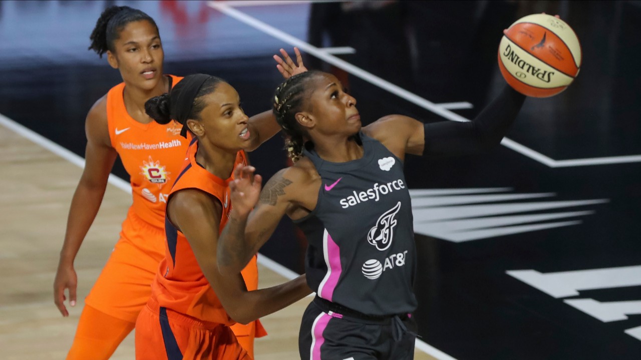 Indiana Fever's Tiffany Mitchell (25) drives past Connecticut Sun's DeWanna Bonner (24) during the first half of a WNBA basketball game Saturday, Sept. 5, 2020, in Bradenton, Fla. (Mike Carlson/AP)