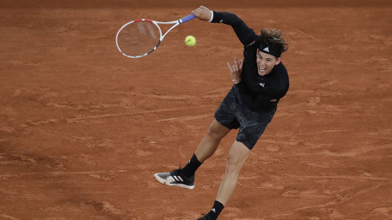 Austria's Dominic Thiem serves against Croatia's Marin Cilic in the first round match of the French Open tennis tournament at the Roland Garros. (Alessandra Tarantino/AP)