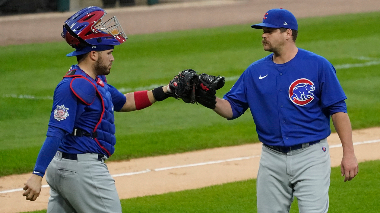 Chicago Cubs relief pitcher Andrew Chafin, right, celebrates with catcher Victor Caratini after they defeated the Chicago White Sox in a baseball game in Chicago, Sunday, Sept. 27, 2020. (Nam Y. Huh/AP)
