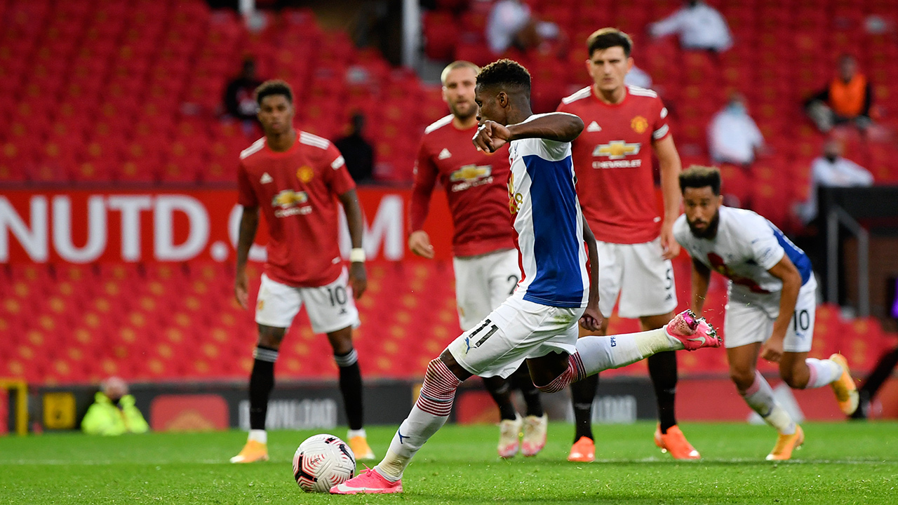 Crystal Palace's Wilfried Zaha scores his side's second goal during the English Premier League soccer match between Manchester United and Crystal Palace at the Old Trafford stadium in Manchester, England, Saturday, Sept. 19, 2020. (Shaun Botterill/Pool via AP)