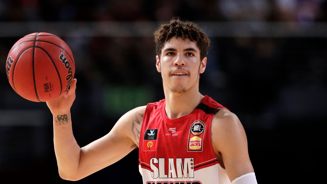 In this Nov. 17, 2019, file photo, LaMelo Ball of the Illawarra Hawks carries the ball up during their game against the Sydney Kings in the Australian Basketball League. (Rick Rycroft, File, AP)