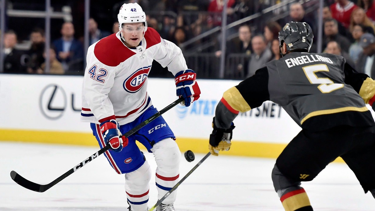 Montreal Canadiens center Byron Froese (42) and Vegas Golden Knights defenseman Deryk Engelland go after the puck during the first period of an NHL hockey game. (David Becker/AP)