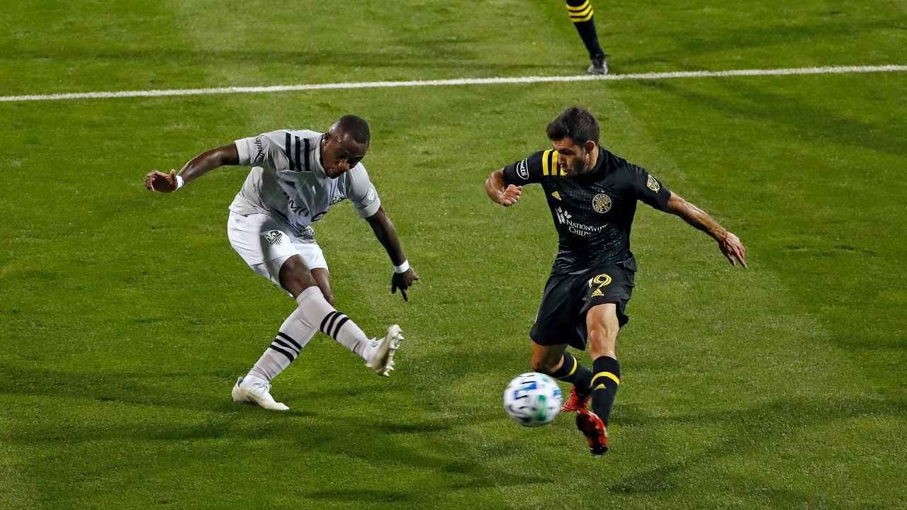 Columbus Crew's Milton Valenzuela, right, blocks the shot of Montreal Impact's Zachary Brault-Guillard (15) during the first half of an MLS soccer match. (Kyle Robertson/The Columbus Dispatch via AP)