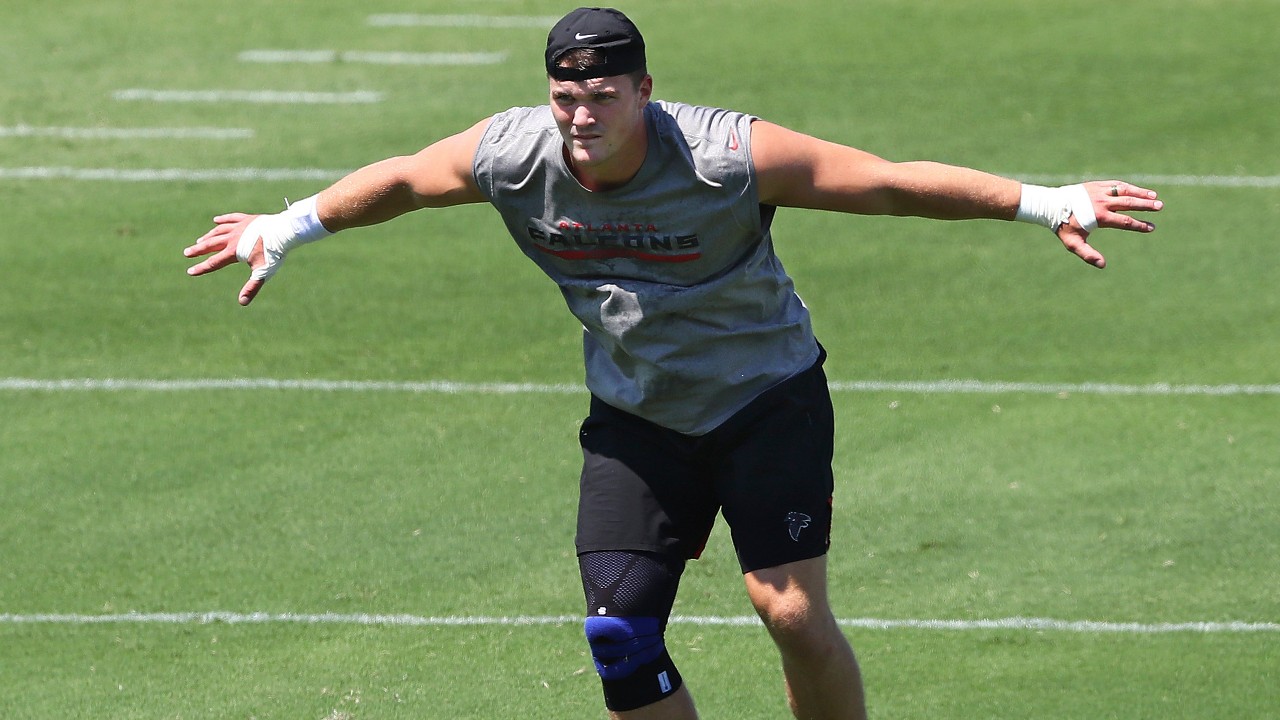 Atlanta Falcons defensive end John Cominsky loosens up during a team strength and conditioning workout on Tuesday, Aug. 4, 2020, in Flowery Branch, Ga. (Curtis Compton/Atlanta Journal-Constitution via AP)