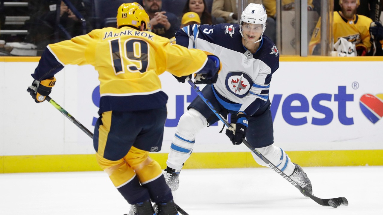 Winnipeg Jets defenceman Luca Sbisa (5) has re-signed with the team. (Mark Humphrey/AP)