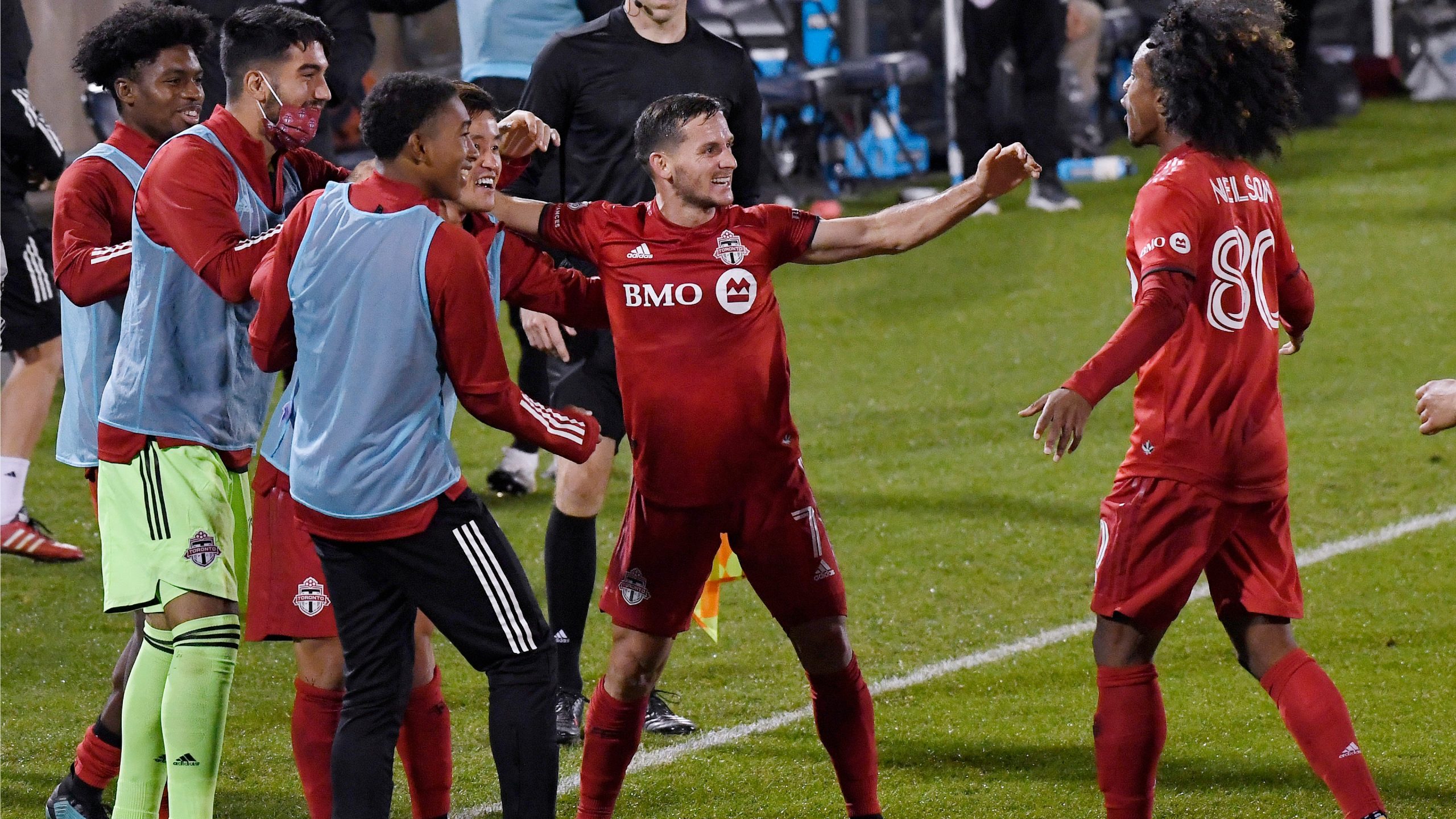 Toronto FC's Pablo Piatti, center, celebrates his goal with this team during the second half of an MLS soccer match against Atlanta United. (Jessica Hill/AP)