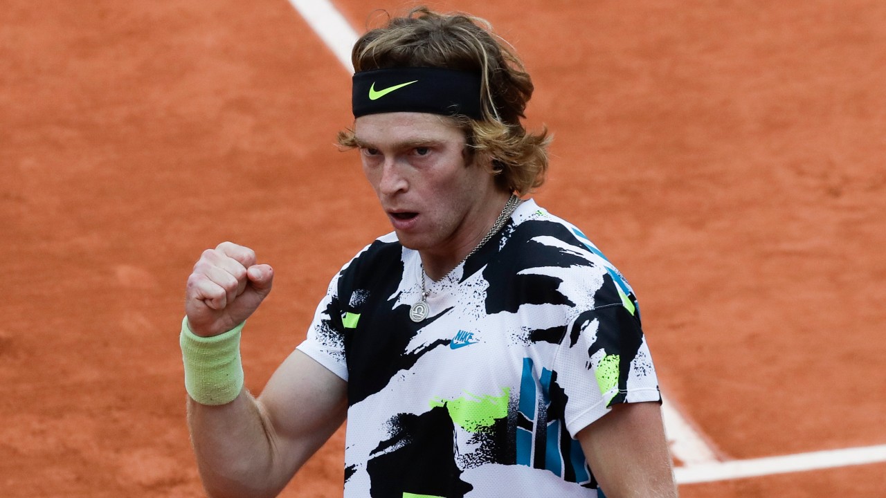 Russia's Andrey Rublev clenches his fist after scoring a point against Hungary's Marton Fucsovics in the fourth round match of the French Open tennis tournament. (Alessandra Tarantino/AP)