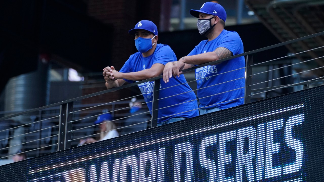 Los Angeles Dodgers fans watch batting practice before Game 2 of the baseball World Series against the Tampa Bay Rays Wednesday, Oct. 21, 2020, in Arlington, Texas. (Eric Gay / AP)