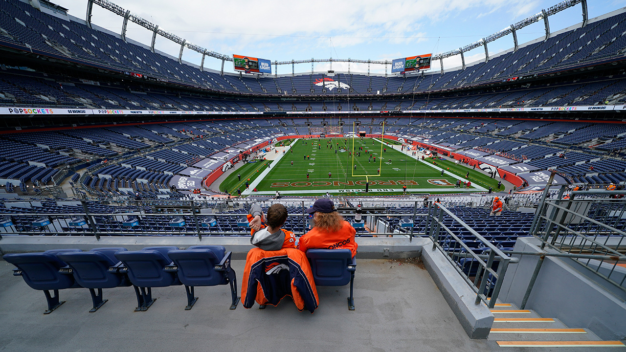 Fans look on before an NFL game between the Denver Broncos and the Tampa Bay Buccaneers Sunday, Sept. 27, 2020, in Denver. (David Zalubowski/AP)