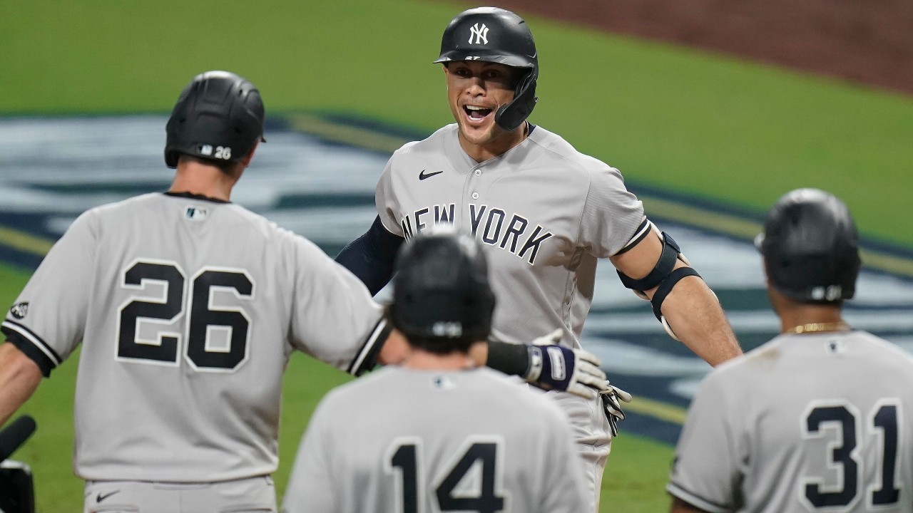 New York Yankees designated hitter Giancarlo Stanton, centre, celebrates with teammates after hitting a grand slam. (AP Photo/Jae C. Hong)