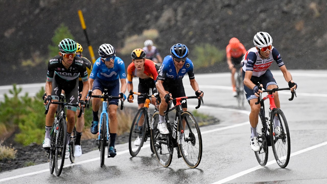 Italy's Vincenzo Nibali, right, leads the pack during the third stage of the Giro d'Italia, tour of Italy cycling race from Enna to Etna, Sicily, Monday, Oct. 5, 2020. (Fabio Ferrari/LaPresse via AP)