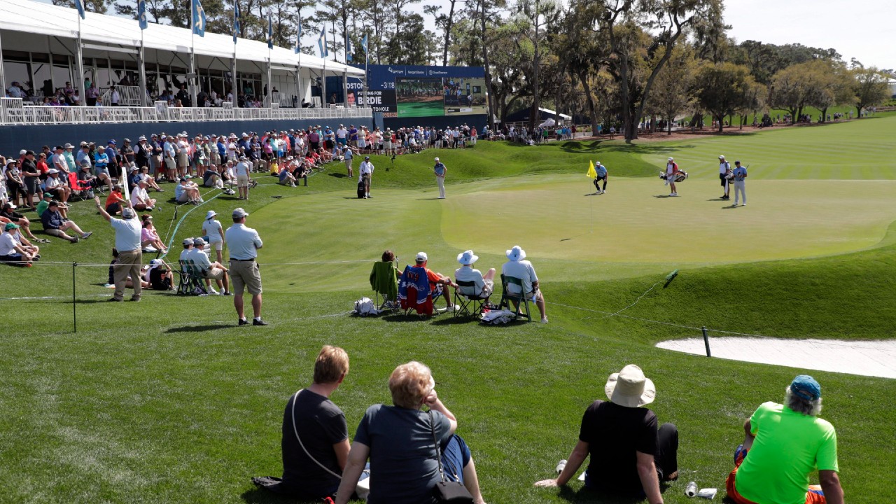 A sparse crowd sits around the 18th green, during the first round of The Players Championship golf tournament Thursday, March 12, 2020 in Ponte Vedra Beach, Fla. The Houston Open is the first domestic PGA event to allow fans since the start of the COVID-19 pandemic. (Lynne Sladky/AP)