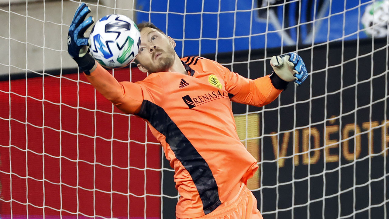 Nashville SC goalkeeper Joe Willis makes a save during the second half of the team's MLS soccer match against the Montreal Impact. (Adam Hunger/AP)