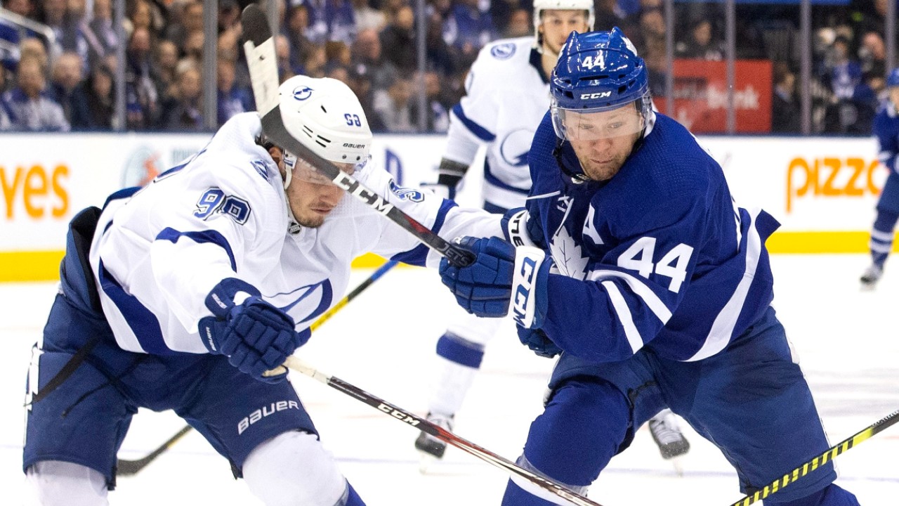 Toronto Maple Leafs defenceman Morgan Rielly (44) tries to break past Tampa Bay Lightning defenceman Mikhail Sergachev (98) during third period NHL hockey action in Toronto on Tuesday March 10, 2020. (Chris Young/CP)
