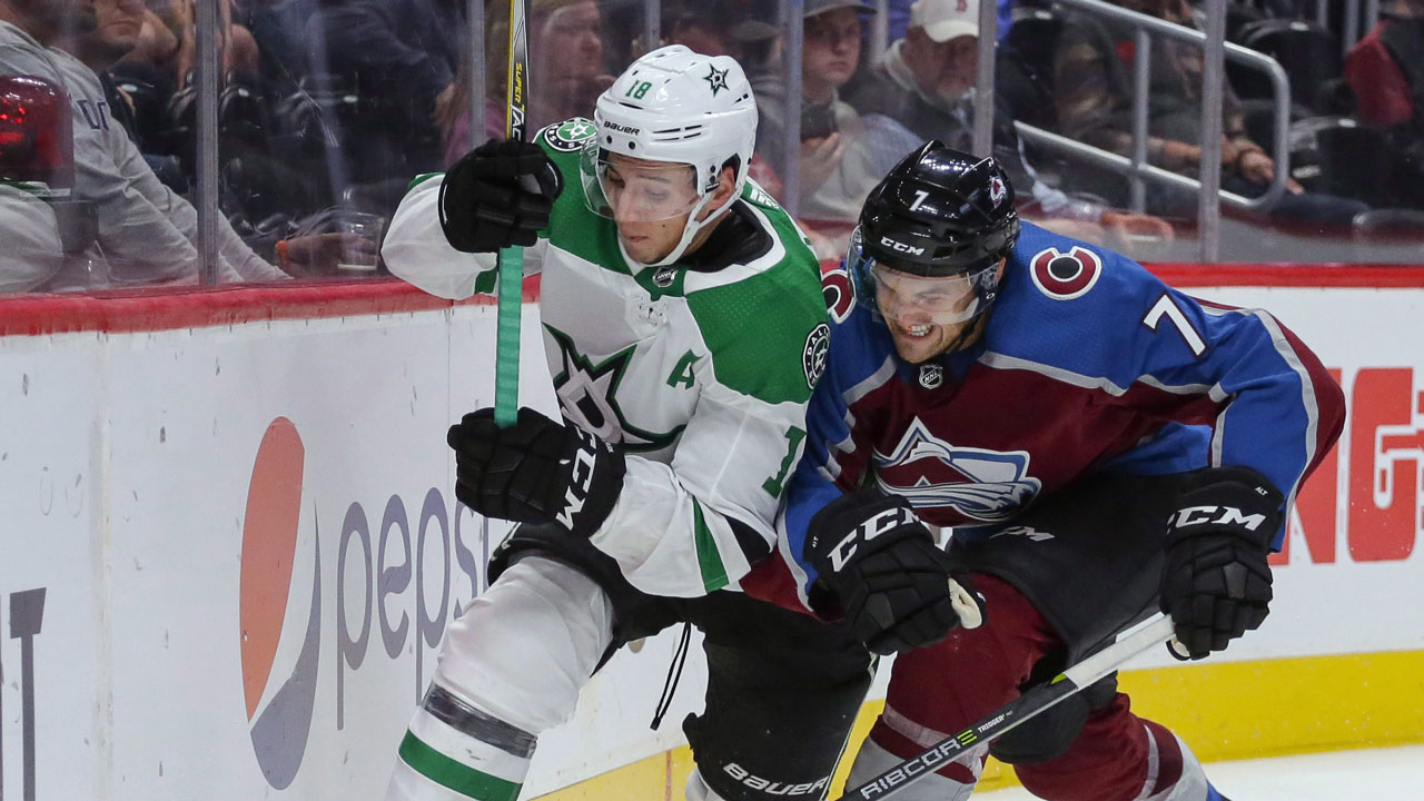 Colorado Avalanche defenseman Mark Alt (7) hits Dallas Stars center Tyler Pitlick (18) into the boards during the second period of a preseason NHL hockey game. (Jack Dempsey/AP)