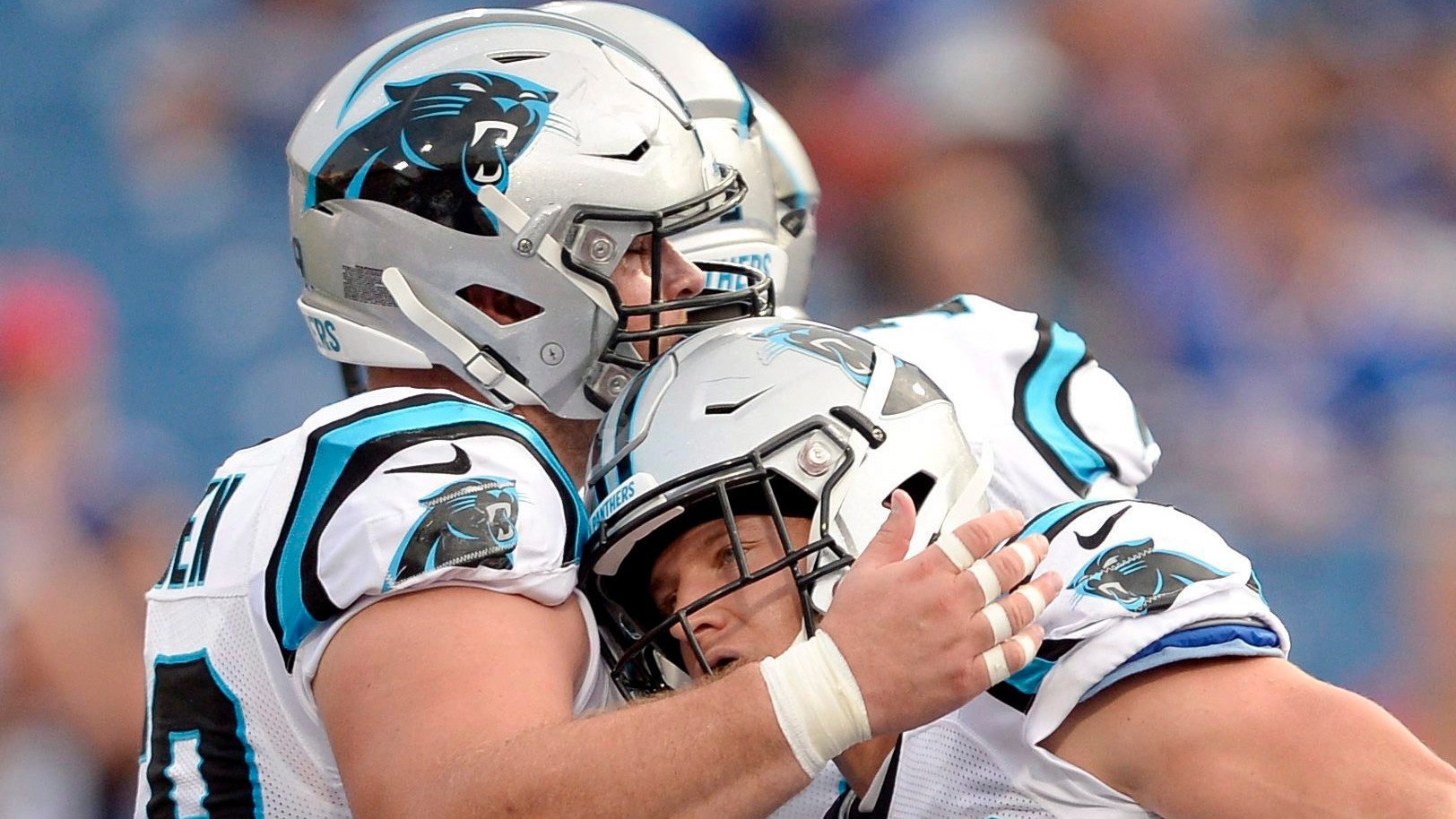 Carolina Panthers running back Christian McCaffrey (22) is congratulated by center Tyler Larsen (69). (AP Photo/Adrian Kraus)