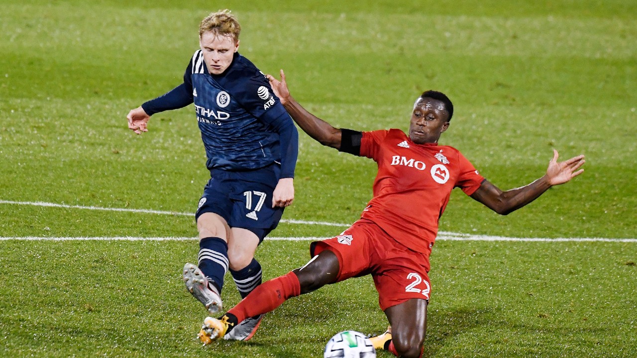 New York City FC's Gary Mackay-Steven kicks the ball as Toronto FC's Richie Laryea defends during the first half of an MLS soccer match, Wednesday, Oct. 28, 2020, in East Hartford, Conn. (Jessica Hill/AP)