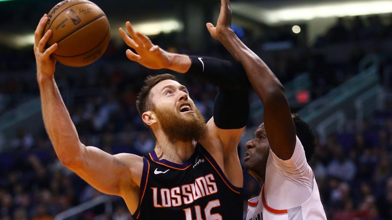 Phoenix Suns center Aron Baynes (46) goes up to shoot against Houston Rockets center Clint Capela, right, during the second half of an NBA basketball game. (Ross D. Franklin/AP)