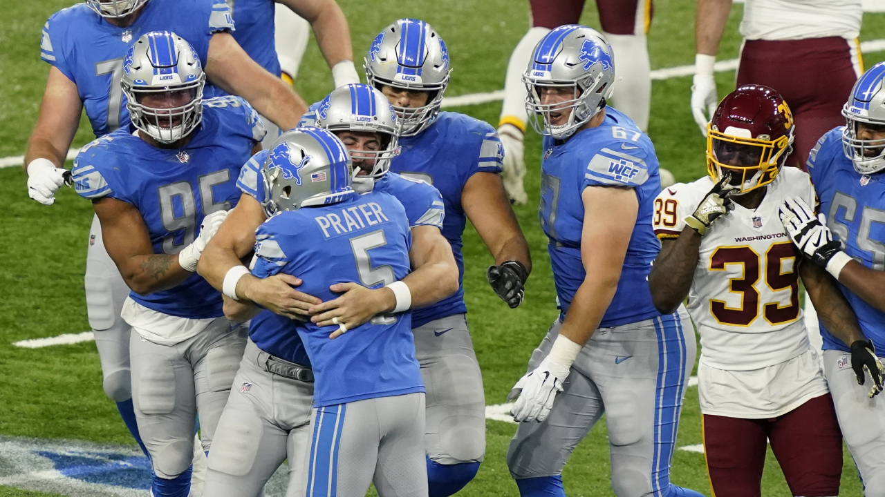 Teammates hug Detroit Lions kicker Matt Prater (5) after his winning field goal in the closing seconds during the second half of an NFL football game against the Washington Football Team, Sunday, Nov. 15, 2020, in Detroit. (Carlos Osorio/AP)