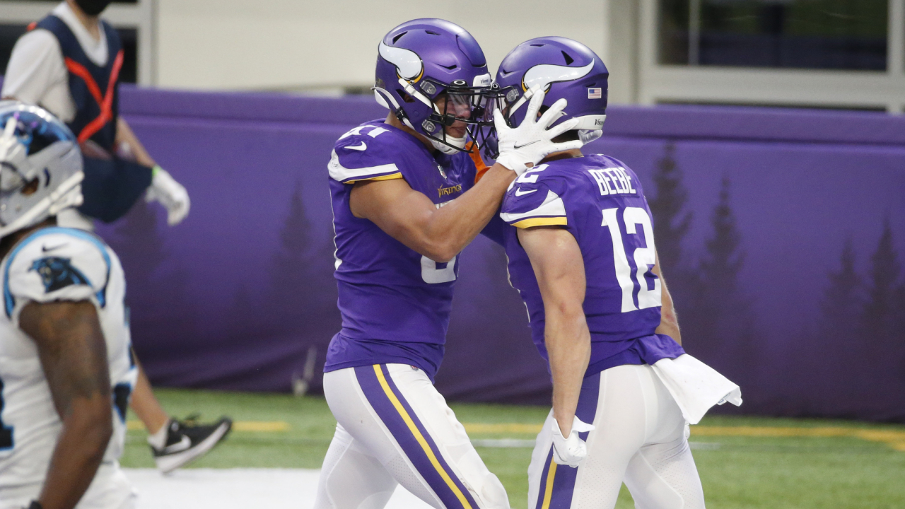 Minnesota Vikings wide receiver Chad Beebe (12) celebrates with teammate Bisi Johnson, left, after catching a 10-yard touchdown pass during the second half of an NFL football game against the Carolina Panthers, Sunday, Nov. 29, 2020, in Minneapolis. (Bruce Kluckhohn/AP)