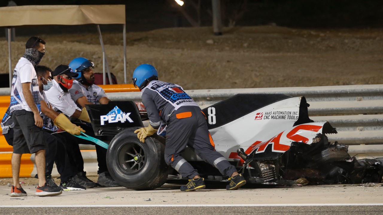 Haas driver Romain Grosjean of France has his car taken after a crash during the Formula One race in Bahrain International Circuit. (Hamad Mohammed, Pool via AP)