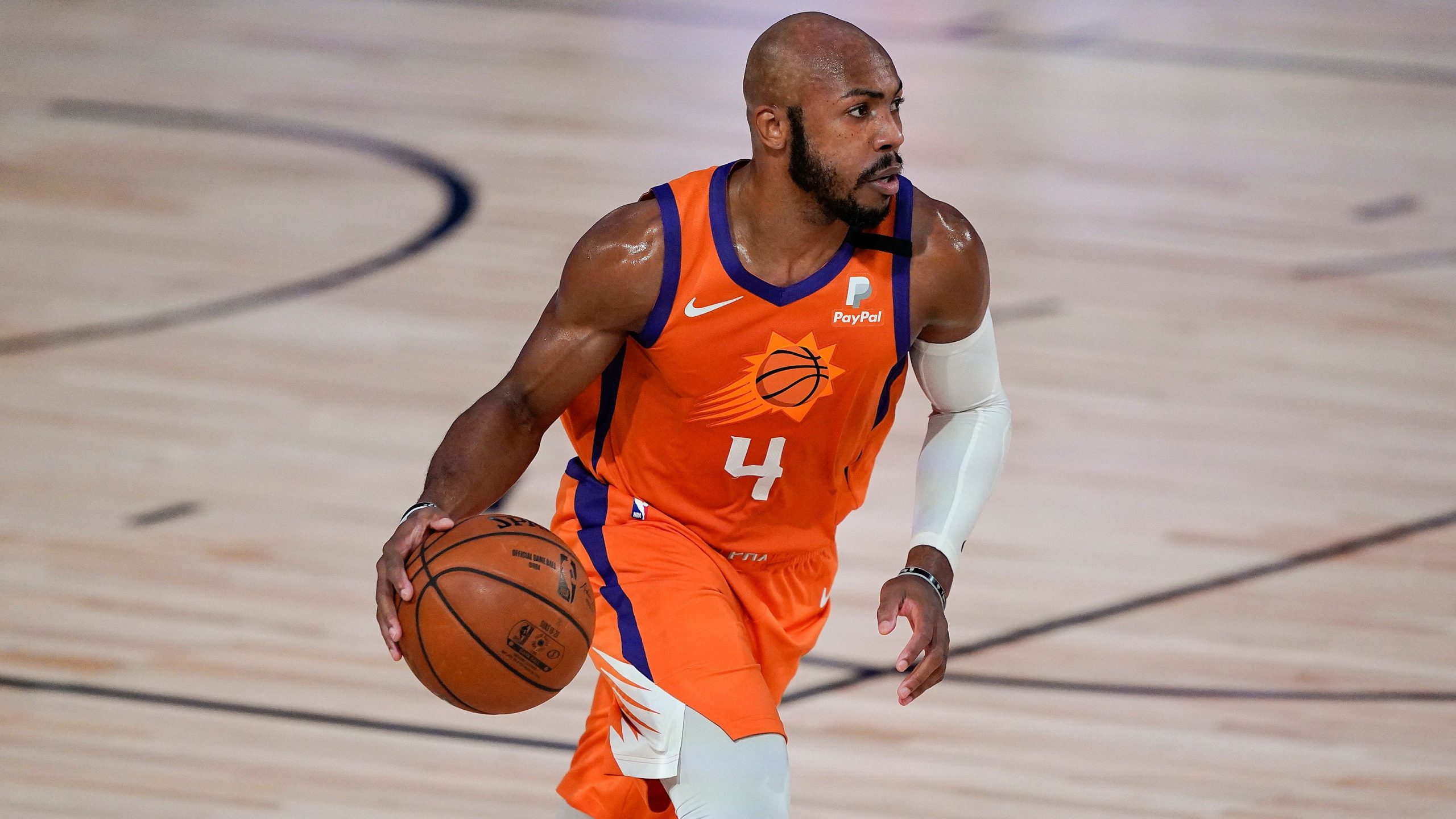 Phoenix Suns guard Jevon Carter (4) brings the ball up court against the Dallas Mavericks during the second half of an NBA basketball game. (Ashley Landis, Pool, AP) 