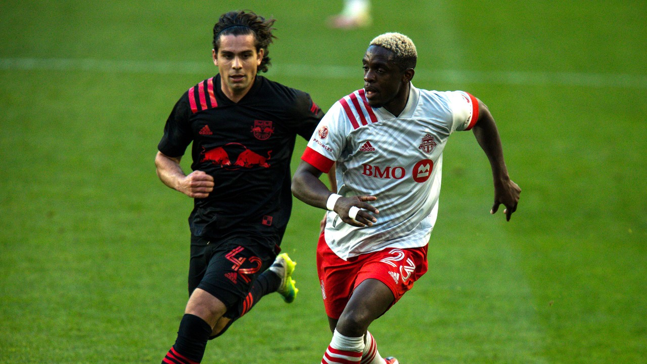 Toronto FC defender Chris Mavinga, right, fights for the ball against New York Red Bulls attacker Brian White during an MLS soccer match, Sunday, Nov. 8, 2020, in Harrison, NJ. (Eduardo Munoz Alvarez / AP)