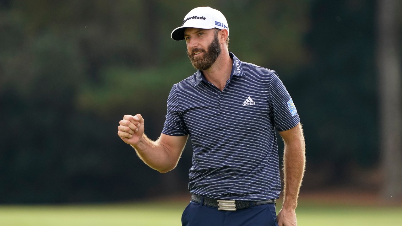 Dustin Johnson pumps his fist after wining the the Masters golf tournament in 2020. (Charlie Riedel / AP)
