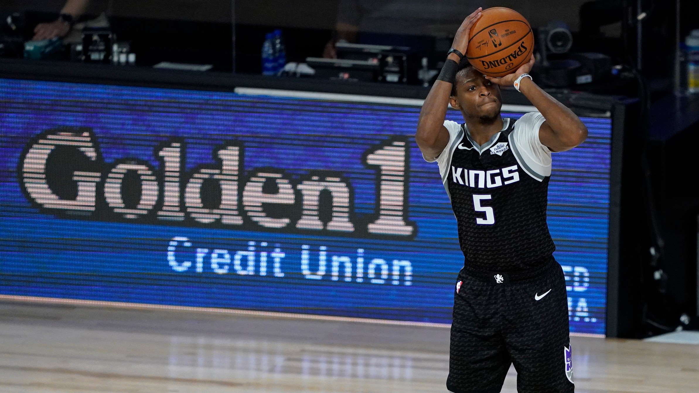 Sacramento Kings' De'Aaron Fox (5) shoots during the second half of an NBA basketball game against the Houston Rockets. (Ashley Landis, Pool, AP)